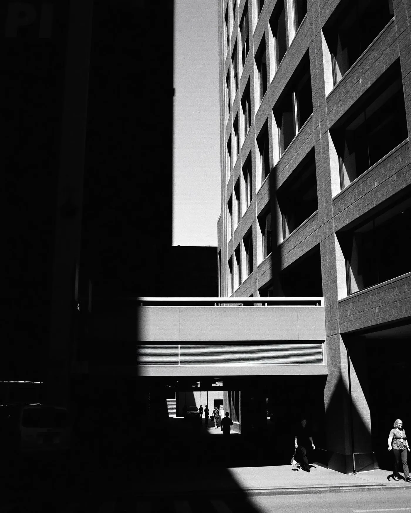 High contrast black and white Austin street architecture with pedestrians